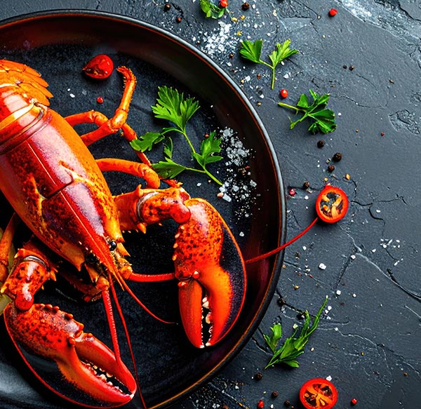 Demi homard à l’américaine et fondue de poireaux
